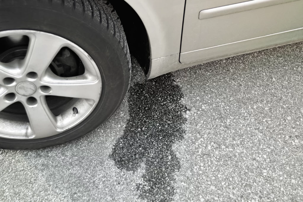 car leaking oil onto ground Mascoutah, IL